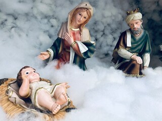 Nativity scene with family in Winter. Christmas decoration in church at India.
