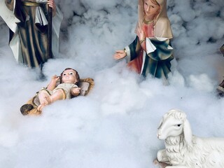Nativity scene with family in Winter. Christmas decoration in church at India.