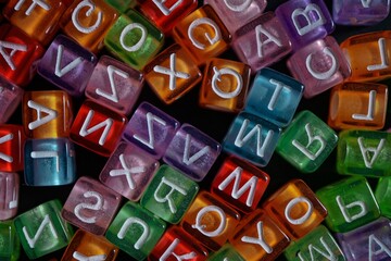 Fototapeta premium colorful letter cubes background. multicolored