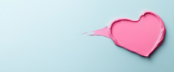 Pink heart-shaped paint smear on light blue background.