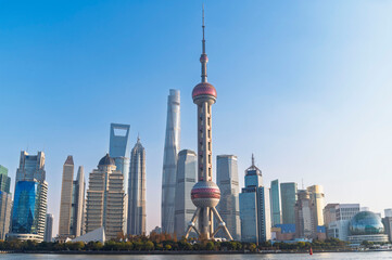 Obraz premium Shanghai city modern skyscraper cityscape in blue sky behind pollution haze, view from the North bund in Shanghai, China.