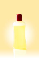 Yellow nail polish removal bottle. Isolated on a yellow background with a glow.