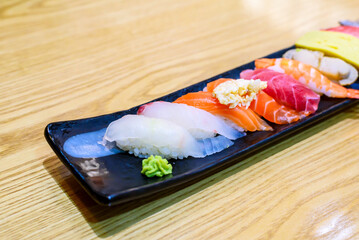 Assorted Fresh Nigiri Sushi on Long Black Plate