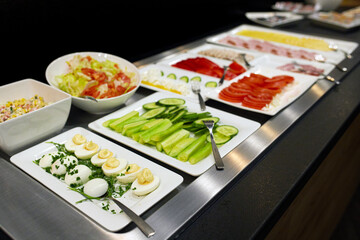 Hotel breakfast buffet, Cuisine mashup buffet served for breakfast at a hotel: Hard-boiled eggs, salad, vegetables