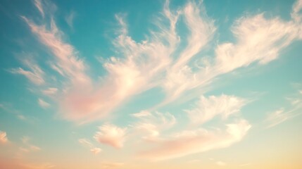 Obraz premium Delicate Clouds: Photograph a pastel-pink sky with wispy cirrus clouds