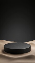 A minimalist round pedestal sits on a sandy surface, illuminated against a dark background, creating a dramatic and elegant presentation.