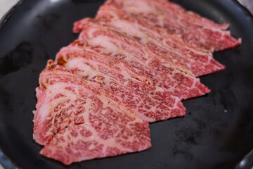 Premium marbled luxury sliced wagyu beef meat for yakiniku grilled steak sukiyaki