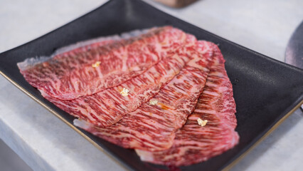 Premium marbled luxury sliced wagyu beef meat for yakiniku grilled steak sukiyaki