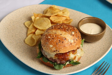 Gourmet Cheeseburger with Caramelized Onions and Chips