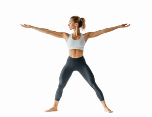 Obraz premium A person doing a yoga Warrior II pose, wearing comfortable fitness attire, front view, centered on a white background to capture the posture