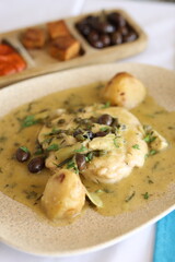 Chicken in Herb Sauce with Potatoes and Olives