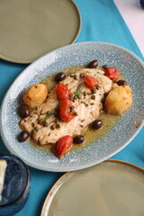  Mediterranean-Style Fish with Potatoes, Cherry Tomatoes, Capers, and Olives

