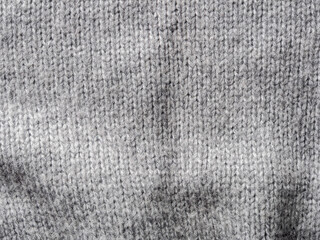 Fototapeta premium A textured gray knitted fabric ideal for cozy pieces and stylish clothing