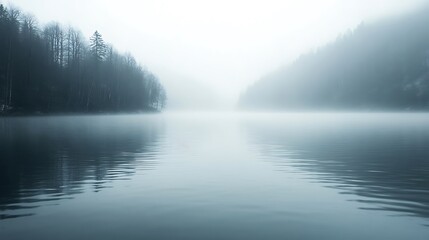 Fototapeta premium Misty Lake: Photograph a lake shrouded in mist