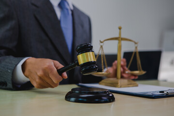 A dark-skinned Asian lawyer, dressed in professional attireon. provide legal advice, preparing cases in law office.