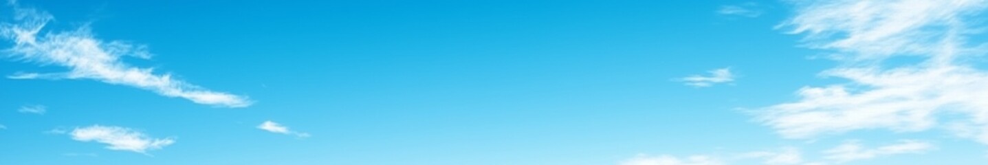 Serene gradient blue sky with few scattered clouds, creating a calm and tranquil atmosphere, perfect as a background for design projects and presentations.