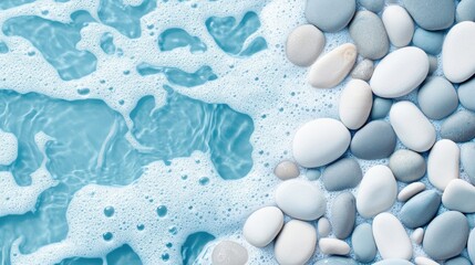 A calm background of sea pebbles partially covered with foam from a gentle ocean wave.