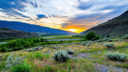 Obraz premium Breathtaking Sunset Over the Majestic Mountain Valley Serene Wilderness Landscape Panorama