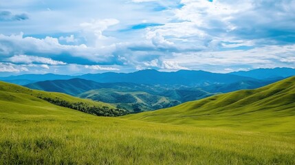 Obraz premium Stunning Green Mountain Landscape with Majestic Peaks and Peaceful Meadows