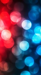 Fototapeta premium Creating a vibrant and festive atmosphere, blurred red and blue lights form a captivating bokeh effect, ideal for backgrounds and designs that celebrate joy and elegance
