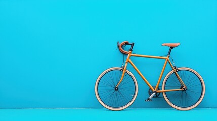 Fototapeta premium Vibrant Minimalist Bicycle on Solid Teal Blue Background