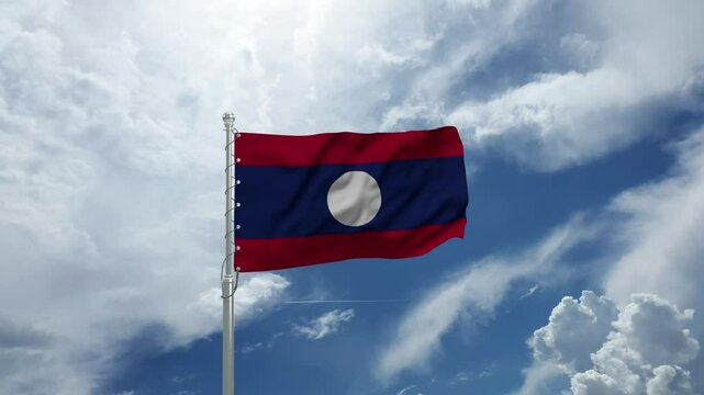 Laos Flag Waving Majestically on a Flagpole Against a Clear Blue Sky in Gentle Wind.