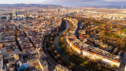 Vienna, Austria Aerial View: Sunset Over City Center and Canal. Top cinematic aerial view. 