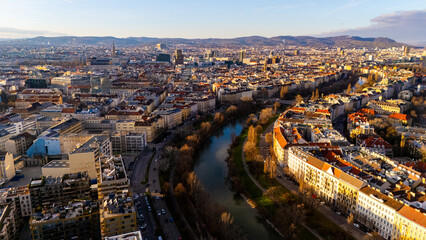 Vienna, Austria Aerial View: Sunset Over City Center and Canal. Top cinematic aerial view. 