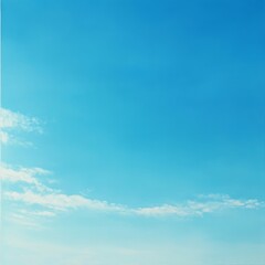 Clear Blue Sky With Wispy Clouds Over a Serene Landscape During Daytime, Showcasing the Beauty of Nature and Tranquility
