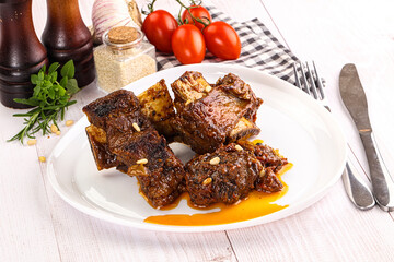 Prepared tasty beef ribs with sauce