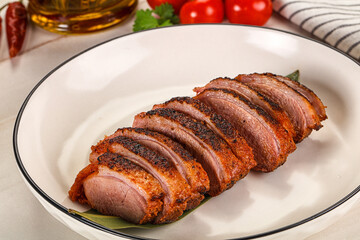 Sliced duck breast baked with cherry