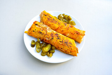 Lavash doner kebab ( soslu kasarli zurna doner durum )  or shawarma sliced in plate isolated.  Tavuk Et Doner Durum. Hatay Iskenderun usulu bazuka tavuk doner durum.