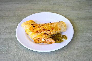 Lavash zurna doner kebab ( zurna  durum )  or shawarma sliced in plate isolated.  hatay usulu tavuk Et doner durum. Gobit ekmek arasi doner. Pilavustu iskender doner kebap. 