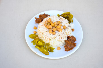 Traditional turkish bulgur pilaf with tomato sause in plate (Turkish name; bulgur pilavi, meyhane pilavi) Pirinc pilavi. Pilavustu tavuk, nohut, kuru fasulye, ciger.
