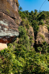 The Naga Cave in Bueng Kan, Thailand, features serpent-like rock formations tied to Naga mythology,...
