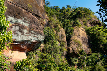 The Naga Cave in Bueng Kan, Thailand, features serpent-like rock formations tied to Naga mythology,...