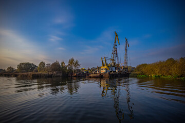 cargo cranes at the port on the Pregolya river in Konigsberg