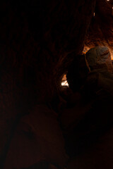 The Naga Cave in Bueng Kan, Thailand, features serpent-like rock formations tied to Naga mythology, attracting visitors to Phu Langka National Park for nature and spirituality