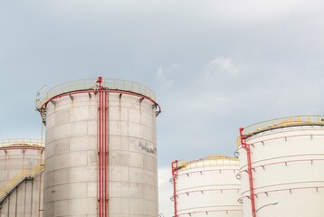 industrial chemical tank or oil or gas storage tank in a factory. industrial tank with clear sky background. photo with low angle object and portrait view