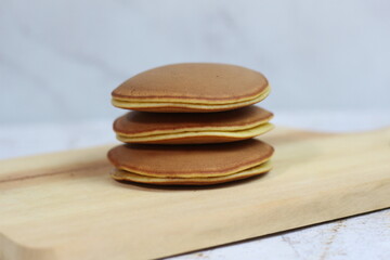 Delicious Stack of Homemade Japanese Pancakes on Wooden Board