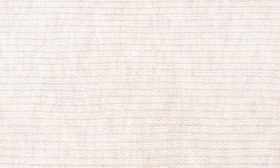 Light beige close up flat knitting background