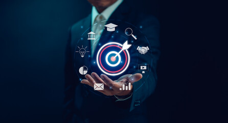 Goal and target concept ,Businessman show dart board and arrows on hand for setting business goals....