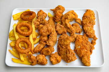 Homemade fried chicken nuggets isolated on white background. Chicken nugget. Citir tavuk. Citir, tavuk atistirma  tabagi.