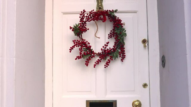 Closing White Front Door Home Christmas Wreath Berries Festive Holiday Season 