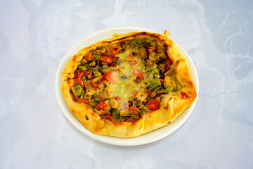 Kiymali pide.Turkish pide with minced meat. Turkish pizza mince pita Pide on white . Etli ekmek.Kusbasi kasarli, kiymali kasarli, kiymali yumurtali, Bafra, Trabzon, Kusbasili pide. Urfa acili lahmacun