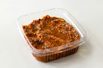 A spicy Turkish appetizer ezme made with tomatoes, bell pepper, parsley, mint, olive oil and hot chili. A kind of adjika. Kahvaltilik acuka, Antep usulu acili ezme.