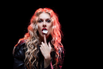 An Edgy Fashion Portrait featuring Playful Makeup, Dramatic and Bold Expression, and Attitude