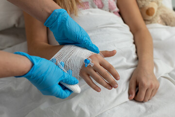 A Child Receiving Medical Care with a Bandaged Hand, Seeking Comfort and Compassionate Attention