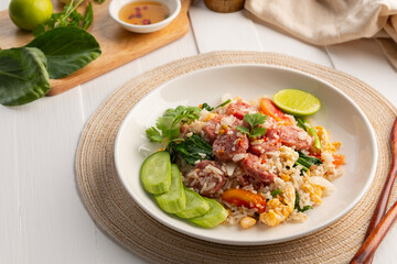 Thai Fried Rice with Sour Pork, Stir fried rice with fermented pork and egg in white plate.(Khao Pad Naem)