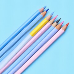 Colorful pencils arranged on a blue background. (1)